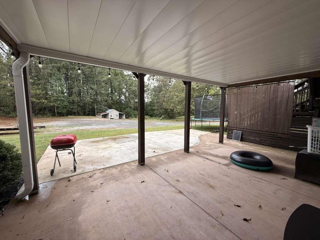 1463 Kellogg Creek Road Acworth, GA 30102 - Photo 12 of 55 a view of a room with gym equipment and windows