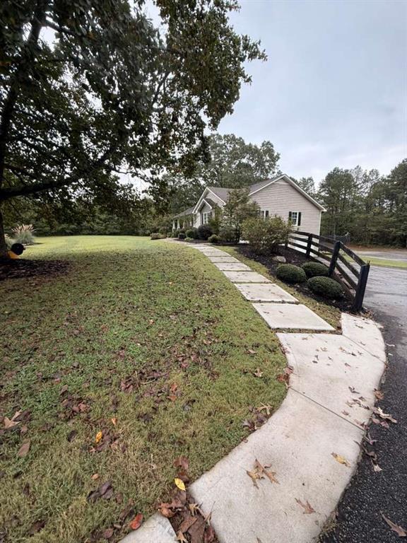 1463 Kellogg Creek Road Acworth, GA 30102 - Photo 14 of 55 a view of a backyard of a house