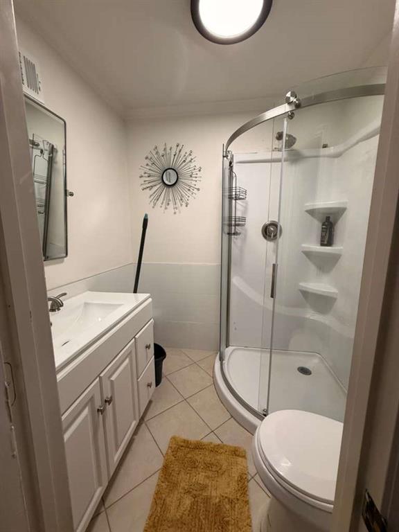 1463 Kellogg Creek Road Acworth, GA 30102 - Photo 25 of 55 a bathroom with a granite countertop toilet sink and shower