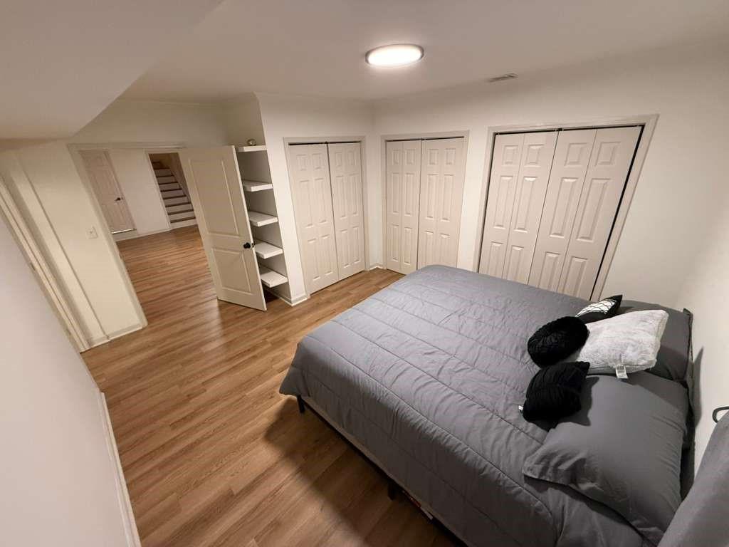 1463 Kellogg Creek Road Acworth, GA 30102 - Photo 27 of 55 a bedroom with a bed window and wooden floor