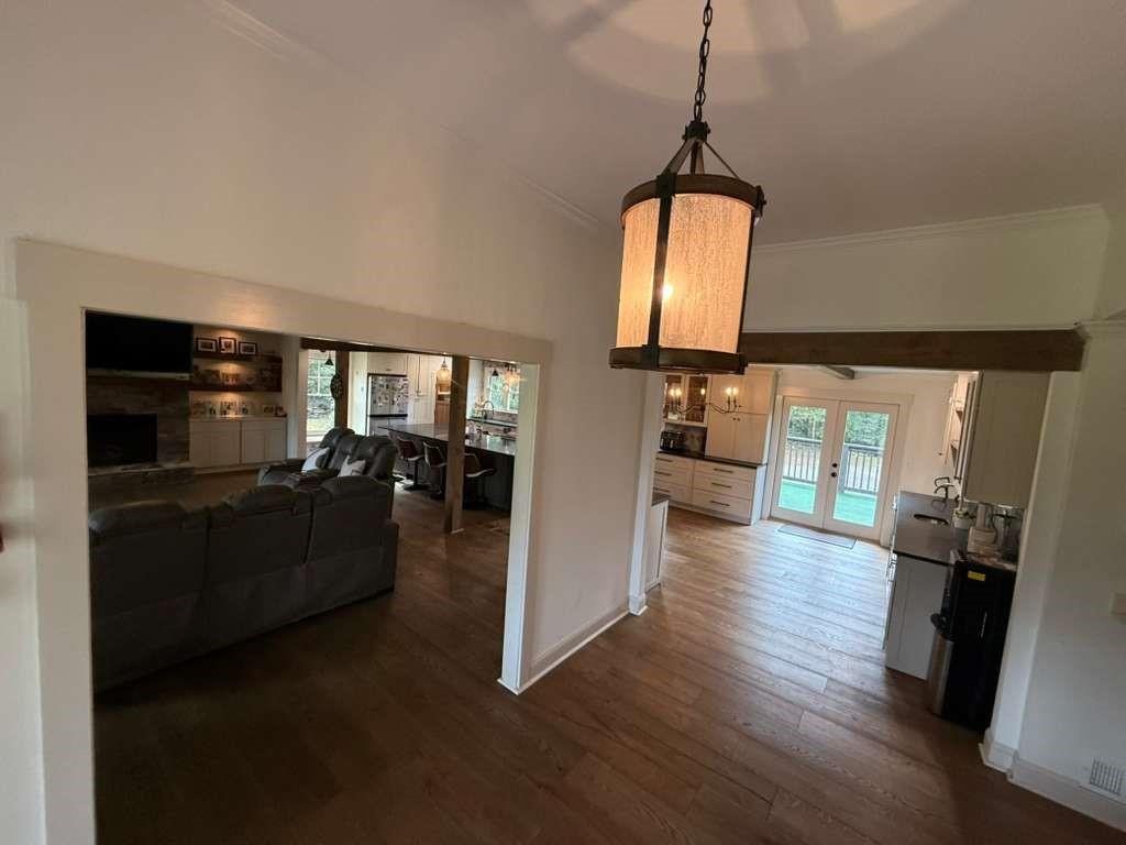 1463 Kellogg Creek Road Acworth, GA 30102 - Photo 33 of 55 a hallway with wooden floor windows and a livingroom