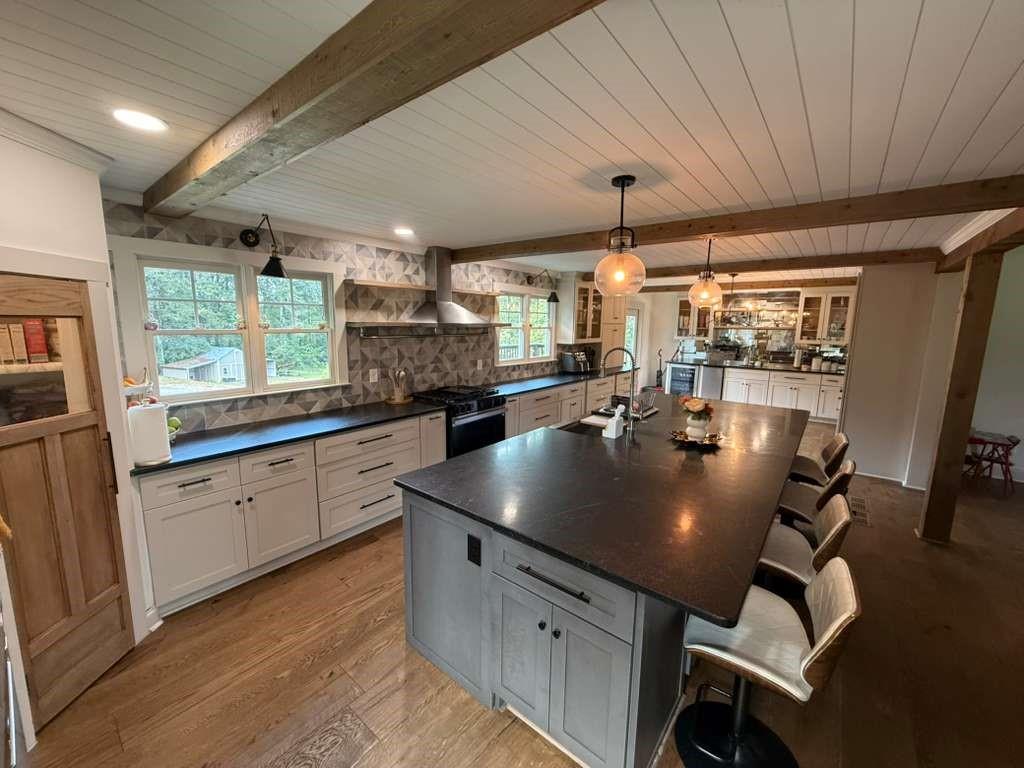 1463 Kellogg Creek Road Acworth, GA 30102 - Photo 37 of 55 a kitchen with stainless steel appliances granite countertop a sink a stove and white cabinets