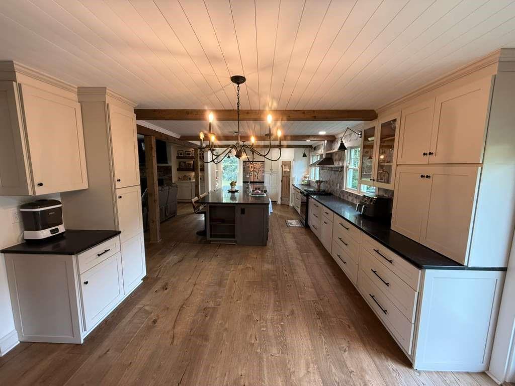 1463 Kellogg Creek Road Acworth, GA 30102 - Photo 41 of 55 a large kitchen with granite countertop a large counter top space a sink stainless steel appliances and cabinets