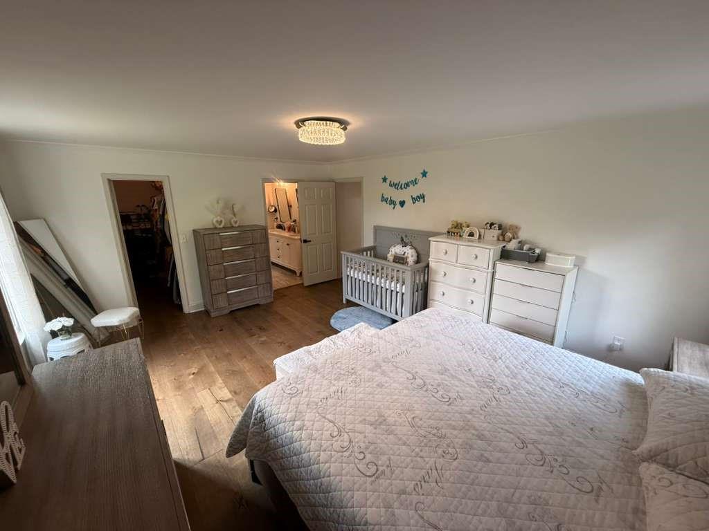 1463 Kellogg Creek Road Acworth, GA 30102 - Photo 50 of 55 a bedroom with a bed and dresser