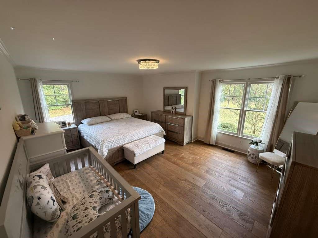 1463 Kellogg Creek Road Acworth, GA 30102 - Photo 51 of 55 a bedroom with a bed and a large window