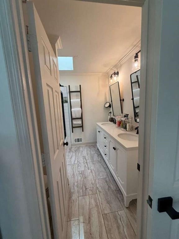 1463 Kellogg Creek Road Acworth, GA 30102 - Photo 52 of 55 a bathroom with a sink a mirror a vanity and window