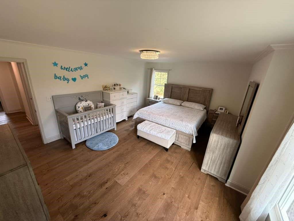 1463 Kellogg Creek Road Acworth, GA 30102 - Photo 53 of 55 a bedroom with a bed and a window