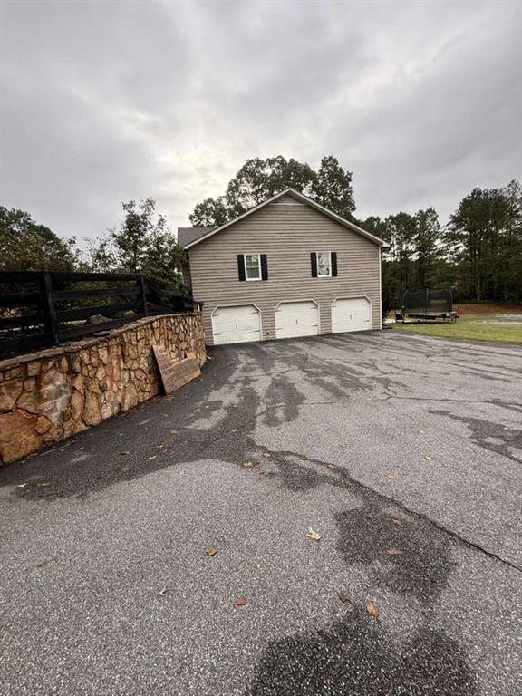 1463 Kellogg Creek Road Acworth, GA 30102 - Photo 6 of 55 a view of a house with a yard