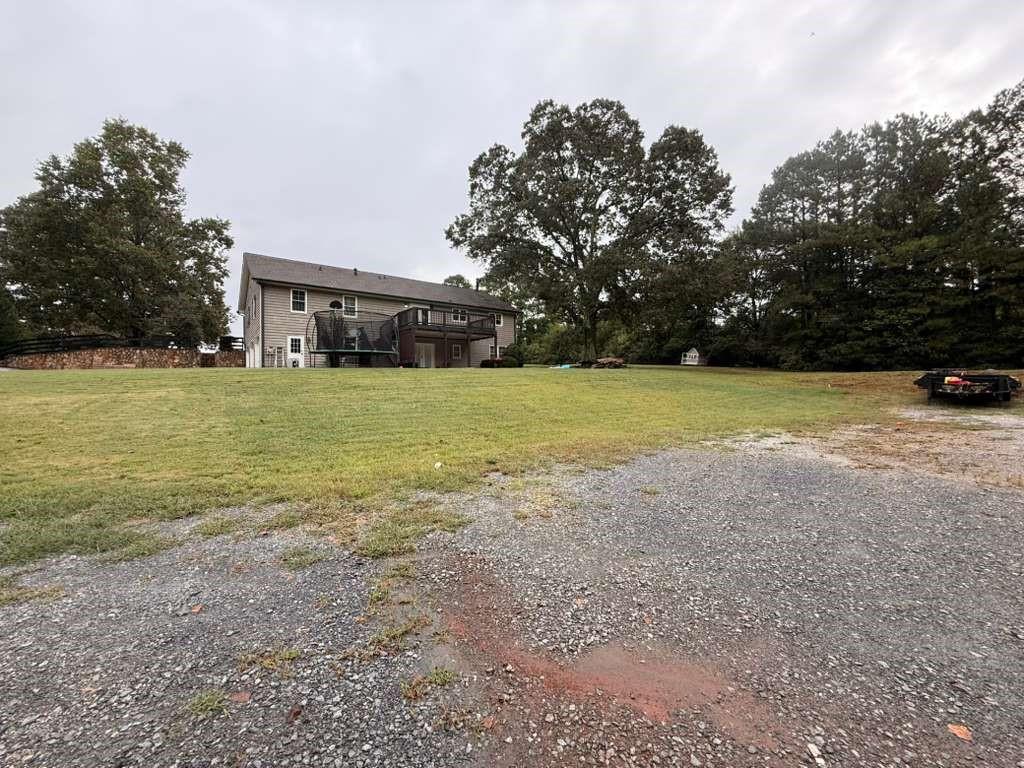 1463 Kellogg Creek Road Acworth, GA 30102 - Photo 9 of 55 a view of an outdoor space and yard
