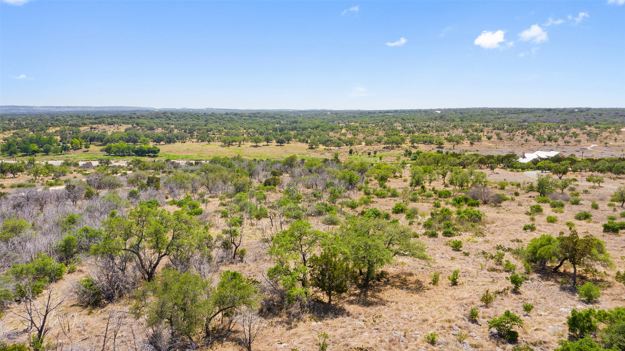 153 One River Point West Johnson City, TX 78636 - Photo 5 of 10 an aerial view of residential houses with outdoor space