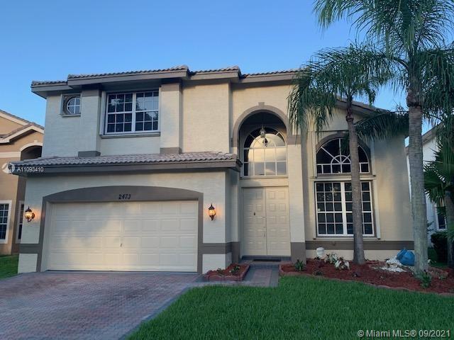 Silver Shores Miramar, FL 33027 - Photo 1 of 21 a front view of a house with a garden