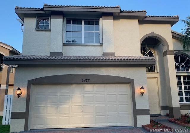 Silver Shores Miramar, FL 33027 - Photo 2 of 21 a front view of a house with parking