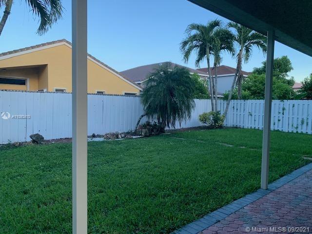 Silver Shores Miramar, FL 33027 - Photo 13 of 21 a view of a backyard with palm trees