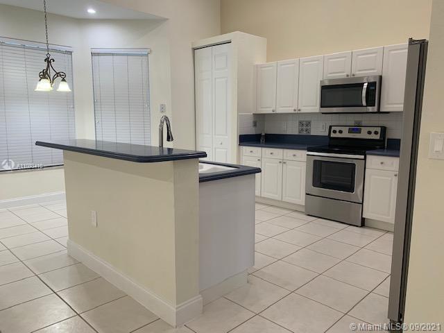 Silver Shores Miramar, FL 33027 - Photo 21 of 21 a kitchen with stainless steel appliances a sink and a stove