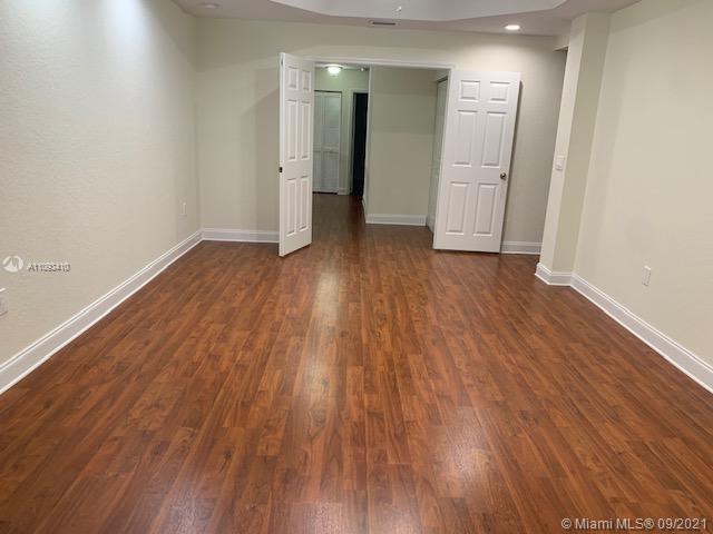 Silver Shores Miramar, FL 33027 - Photo 6 of 21 a view of a hallway with wooden floor