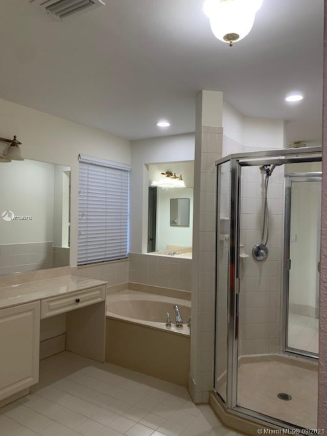 Silver Shores Miramar, FL 33027 - Photo 7 of 21 a bathroom with a bathtub and a sink