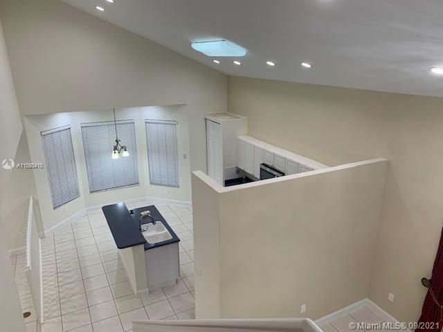 Silver Shores Miramar, FL 33027 - Photo 8 of 21 a view of kitchen with a sink and chairs