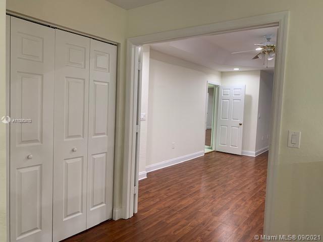Silver Shores Miramar, FL 33027 - Photo 10 of 21 a view of an empty room with wooden floor