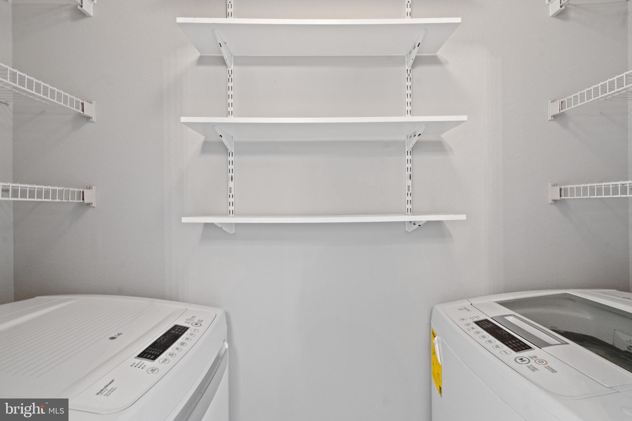 1550 Spring Gate Dr., Unit 8209 McLean, VA 22102 - Photo 11 of 40 a utility room with dryer and washer