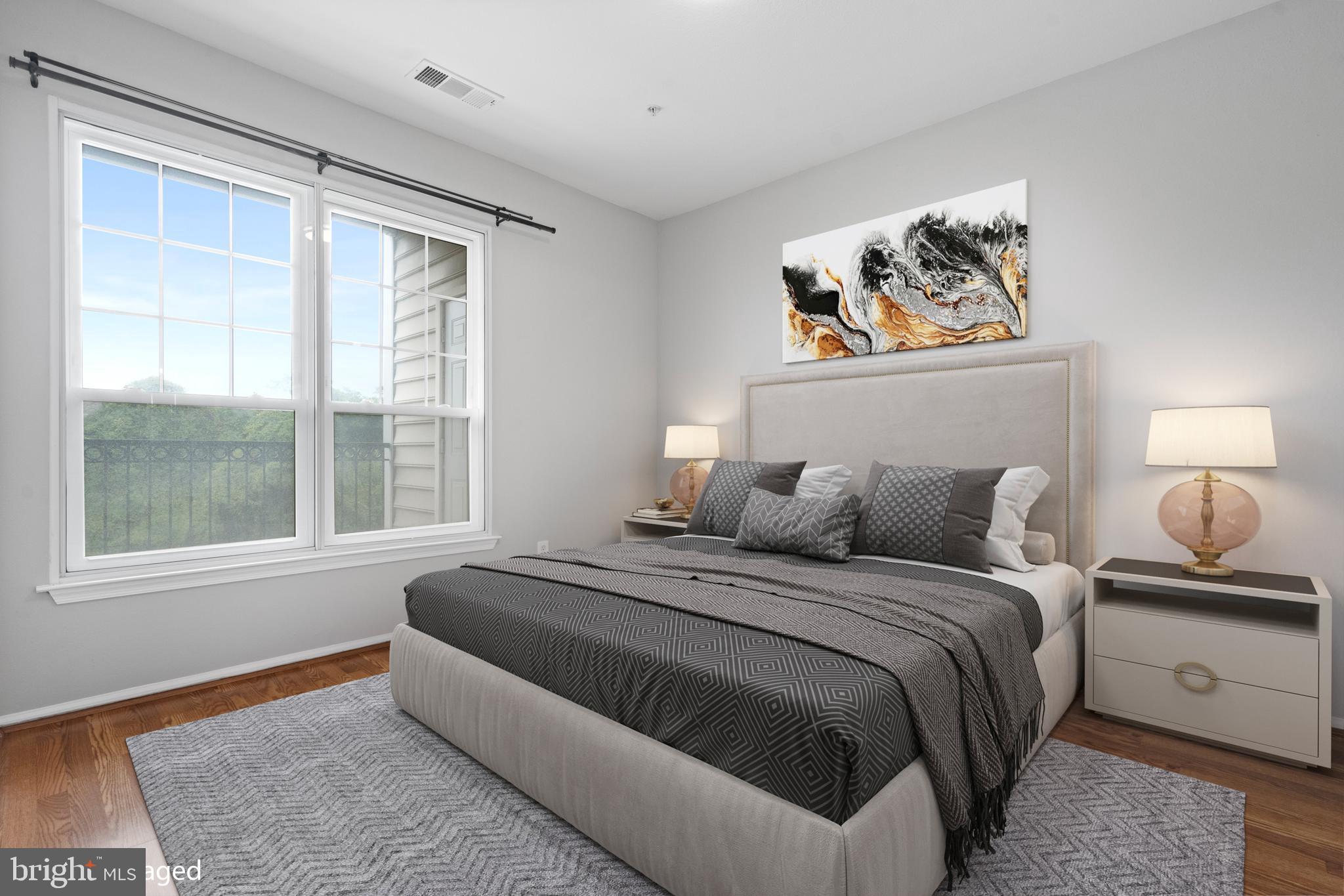 1550 Spring Gate Dr., Unit 8209 McLean, VA 22102 - Photo 12 of 40 a bedroom with a bed and a window