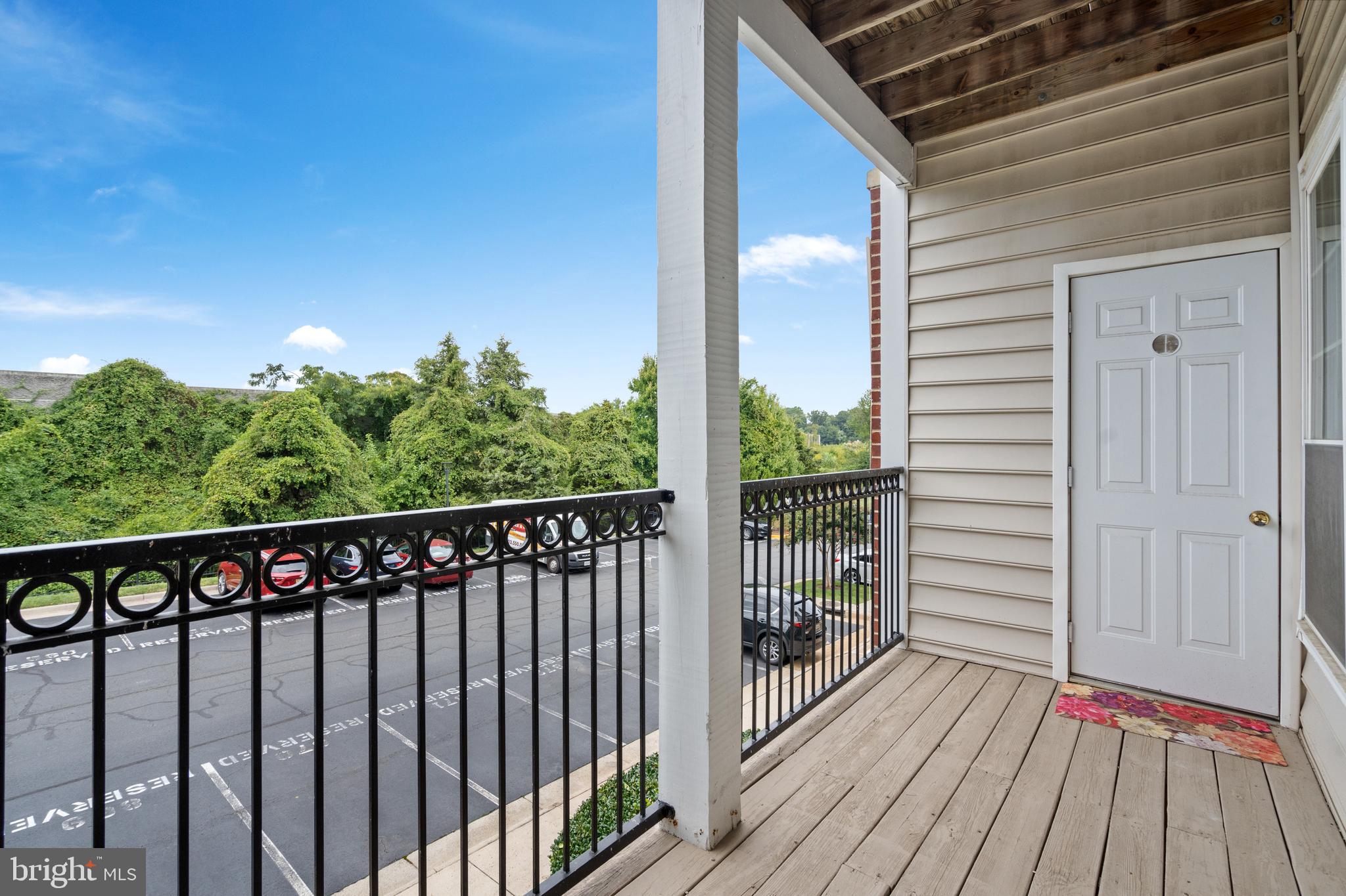 1550 Spring Gate Dr., Unit 8209 McLean, VA 22102 - Photo 25 of 40 a balcony with wooden floor