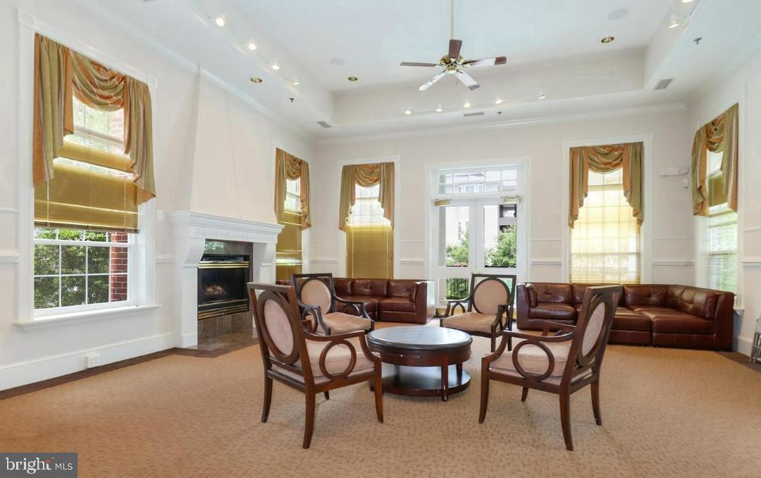 1550 Spring Gate Dr., Unit 8209 McLean, VA 22102 - Photo 28 of 40 a living room with furniture a fireplace and a window