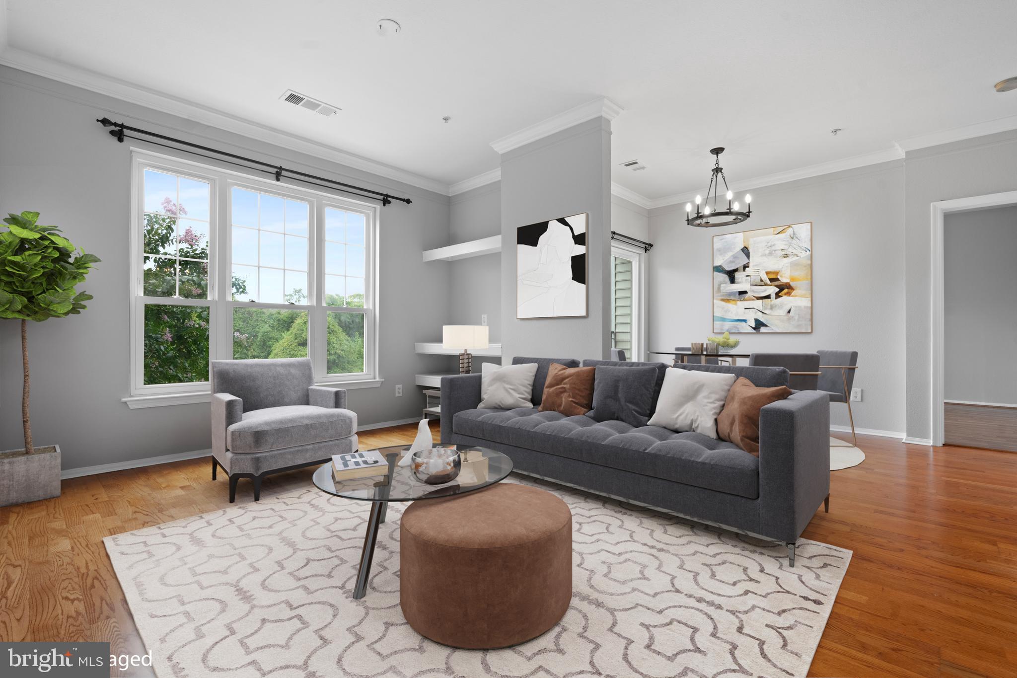 1550 Spring Gate Dr., Unit 8209 McLean, VA 22102 - Photo 3 of 40 a living room with furniture and a large window