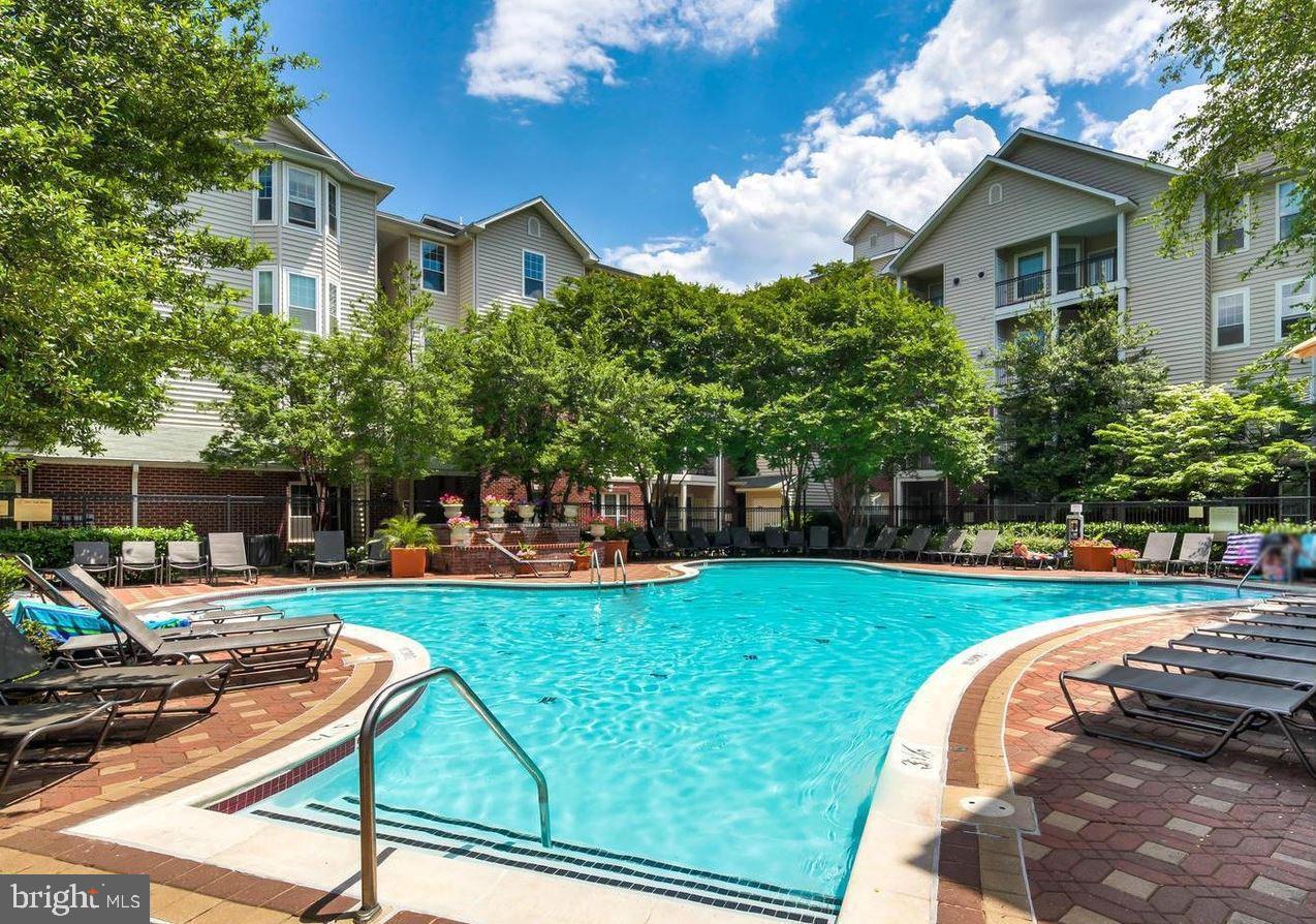 1550 Spring Gate Dr., Unit 8209 McLean, VA 22102 - Photo 31 of 40 a view of a house with backyard sitting area and garden