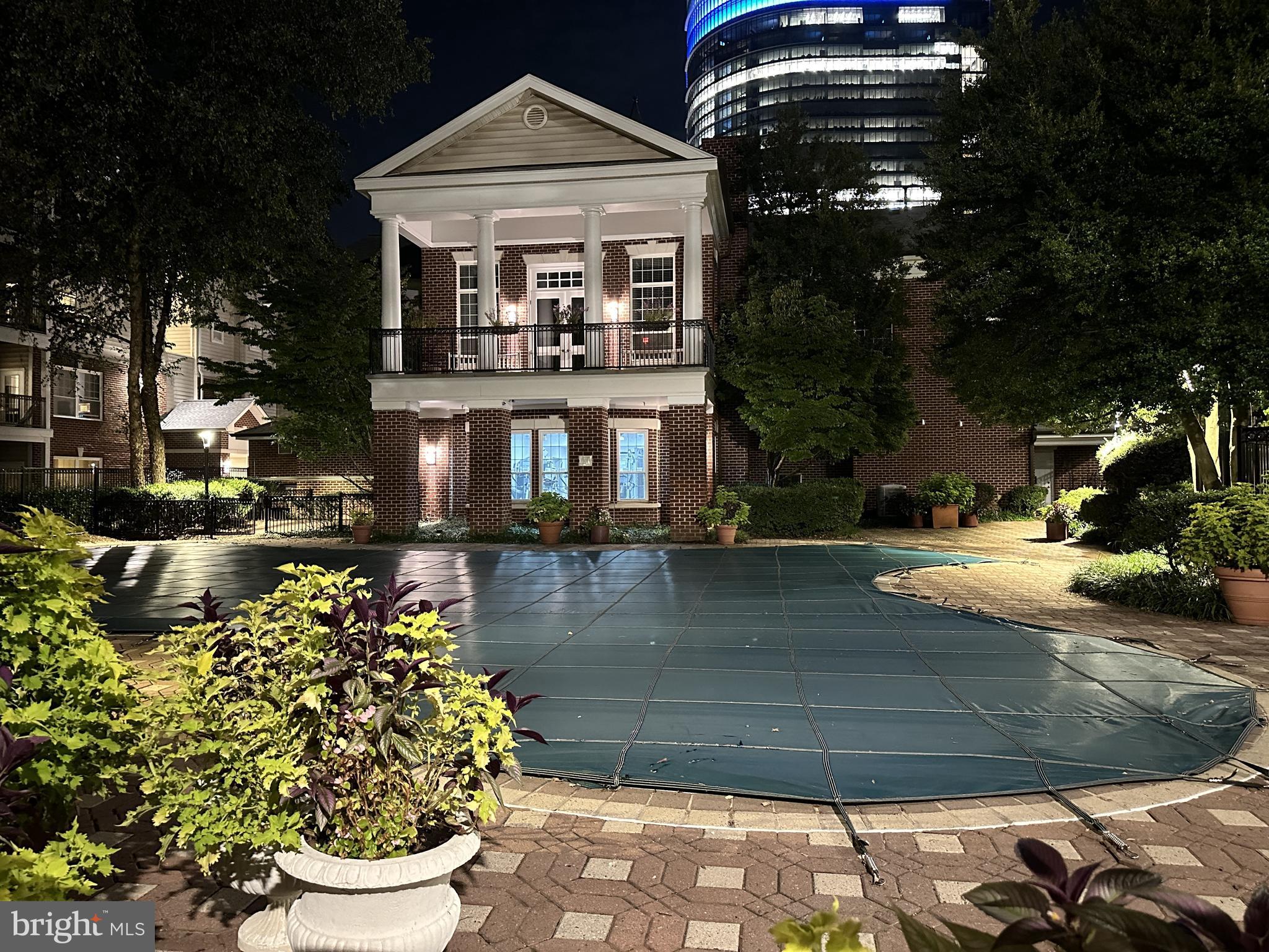 1550 Spring Gate Dr., Unit 8209 McLean, VA 22102 - Photo 32 of 40 a front view of a house with a yard