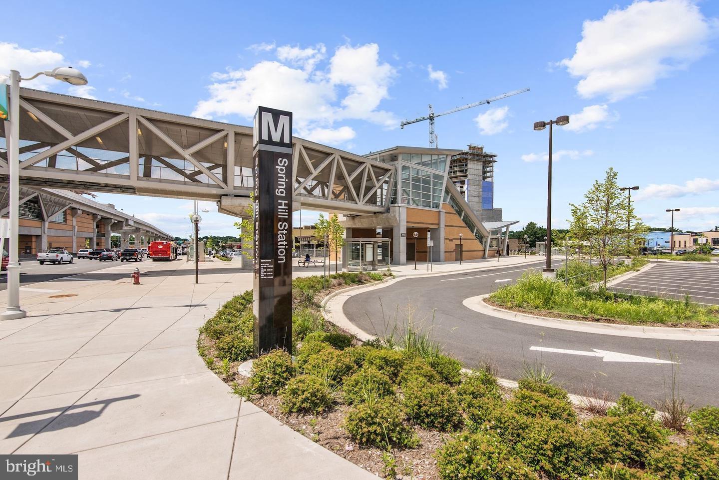 1550 Spring Gate Dr., Unit 8209 McLean, VA 22102 - Photo 37 of 40 a front view of a building with garden and patio