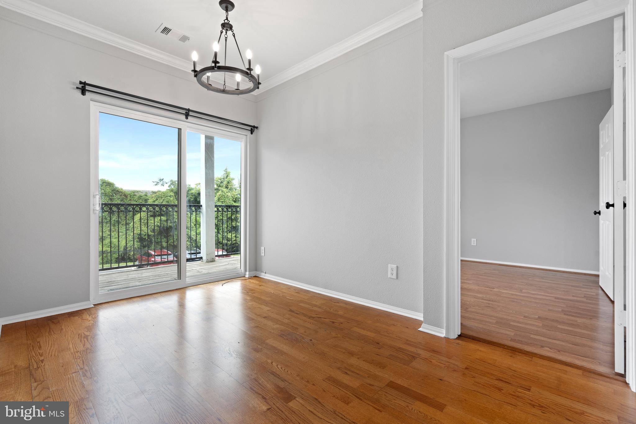 1550 Spring Gate Dr., Unit 8209 McLean, VA 22102 - Photo 8 of 40 a view of livingroom with hardwood floor and window