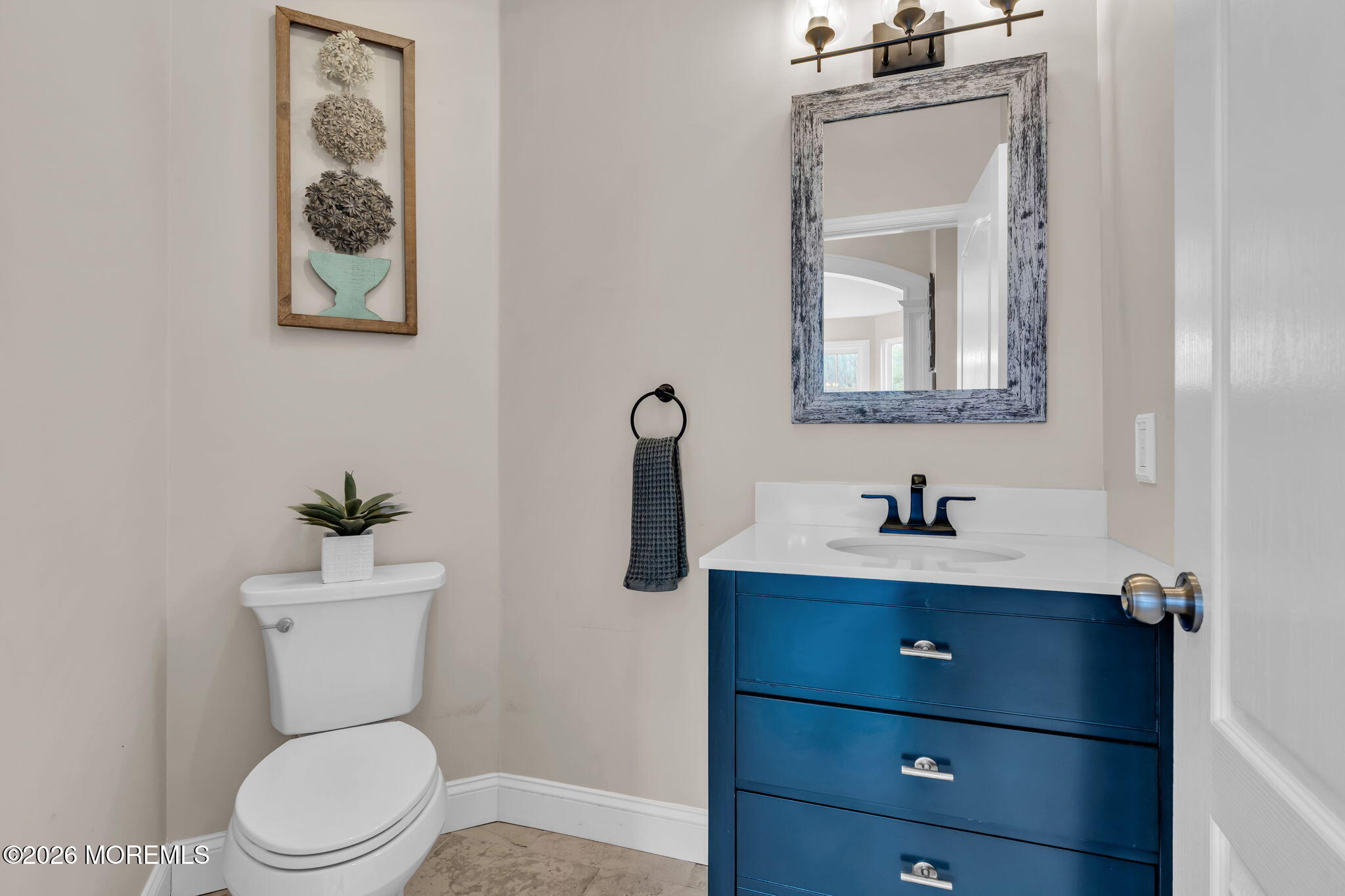 41 Lafayette Mills Road Manalapan, NJ 07726 - Photo 28 of 75 a bathroom with a toilet a sink and mirror