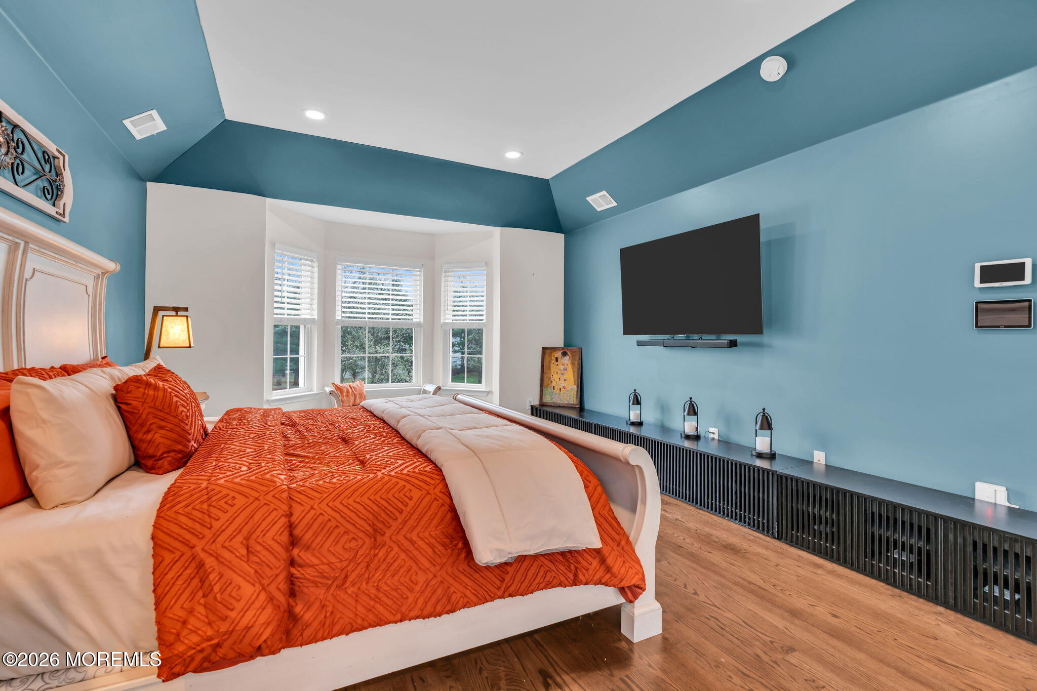 41 Lafayette Mills Road Manalapan, NJ 07726 - Photo 33 of 75 a bedroom with bed a flat tv screen and a large window with the garden view