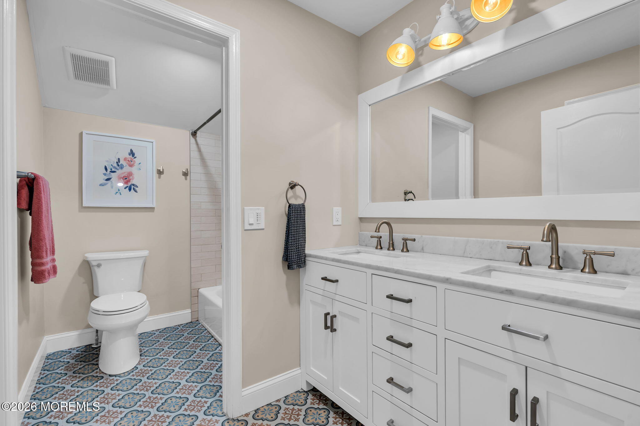 41 Lafayette Mills Road Manalapan, NJ 07726 - Photo 45 of 75 a bathroom with a granite countertop toilet sink and a mirror