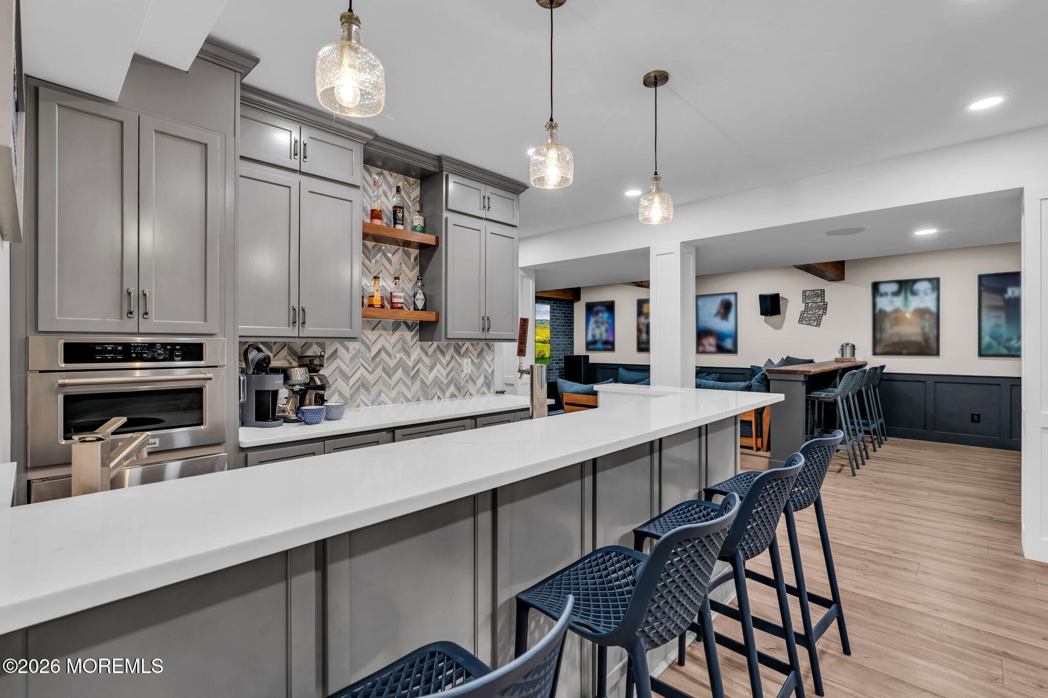 41 Lafayette Mills Road Manalapan, NJ 07726 - Photo 49 of 75 a kitchen with stainless steel appliances kitchen island granite countertop a table chairs in it and wooden floors