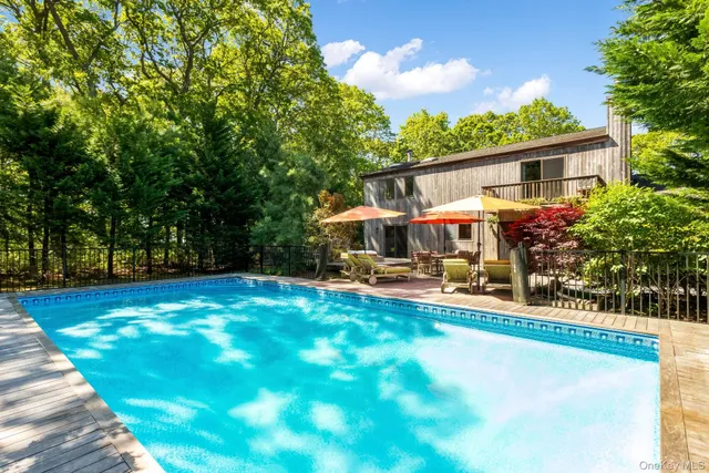 a view of a house with backyard porch and sitting area