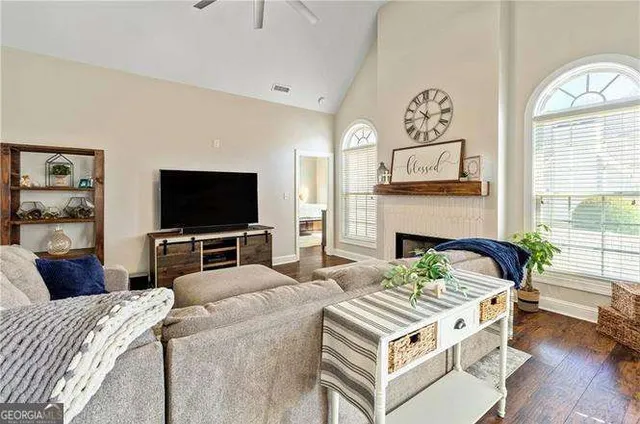 a living room with furniture and a fireplace