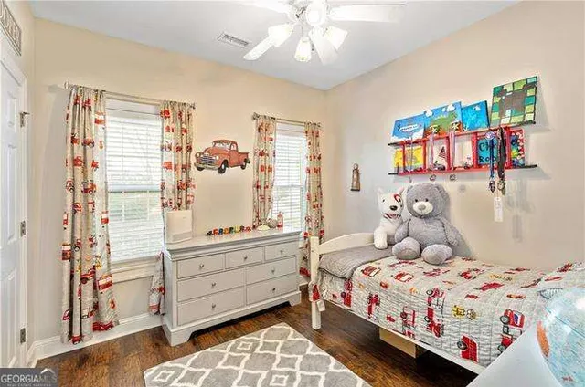 a living room with a bed and a chandelier