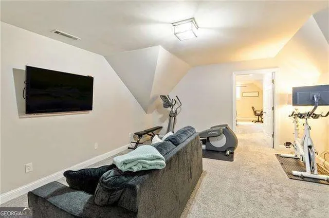 a bedroom with a bed window and a table in it