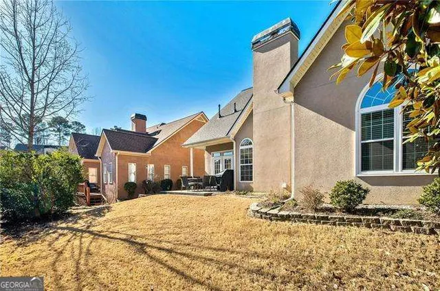 a front view of a house with a yard