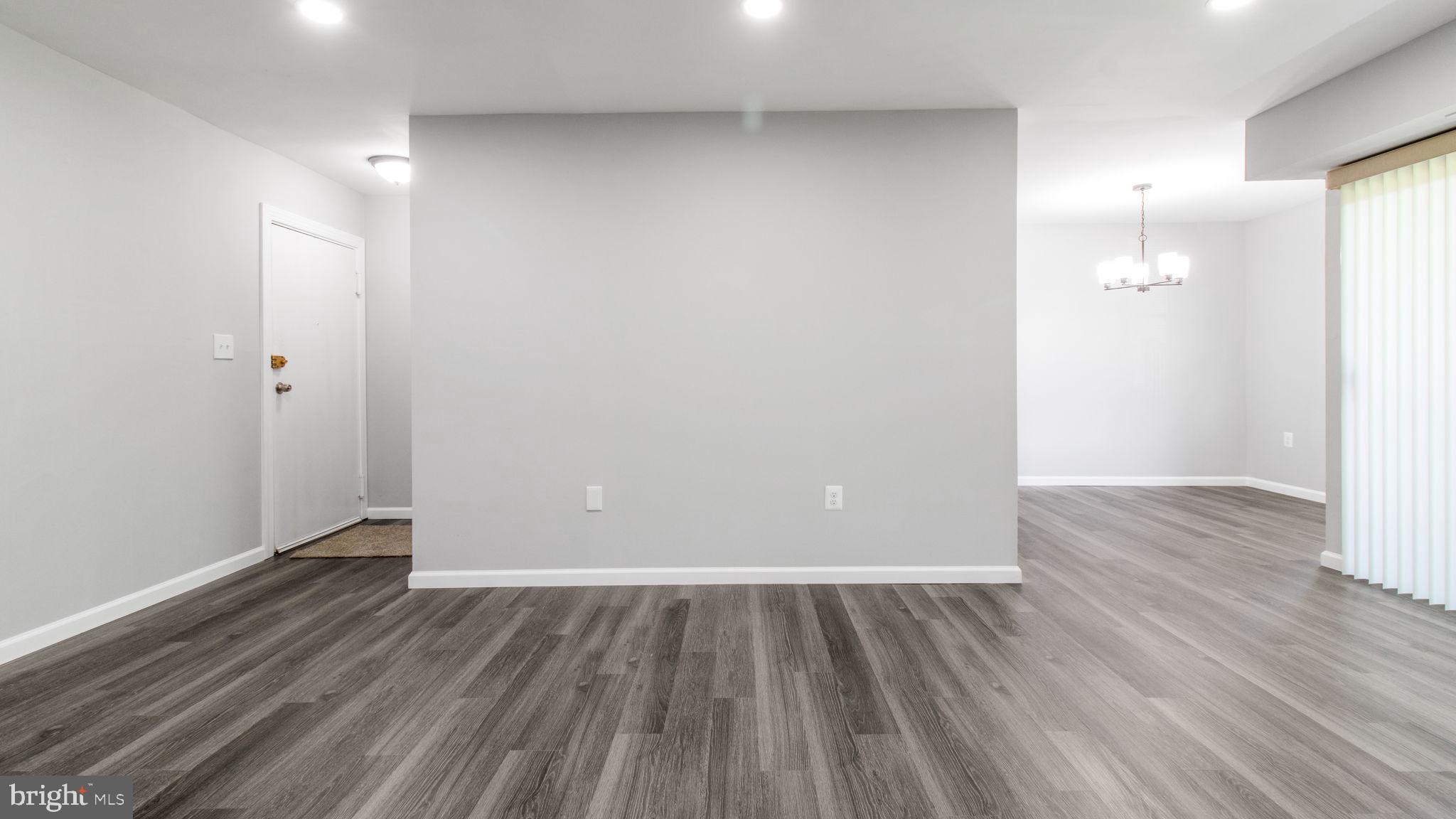 3851 St Barnabas Road, Unit 103 Suitland, MD 20746 - Photo 12 of 43 a view of a room with wooden floor