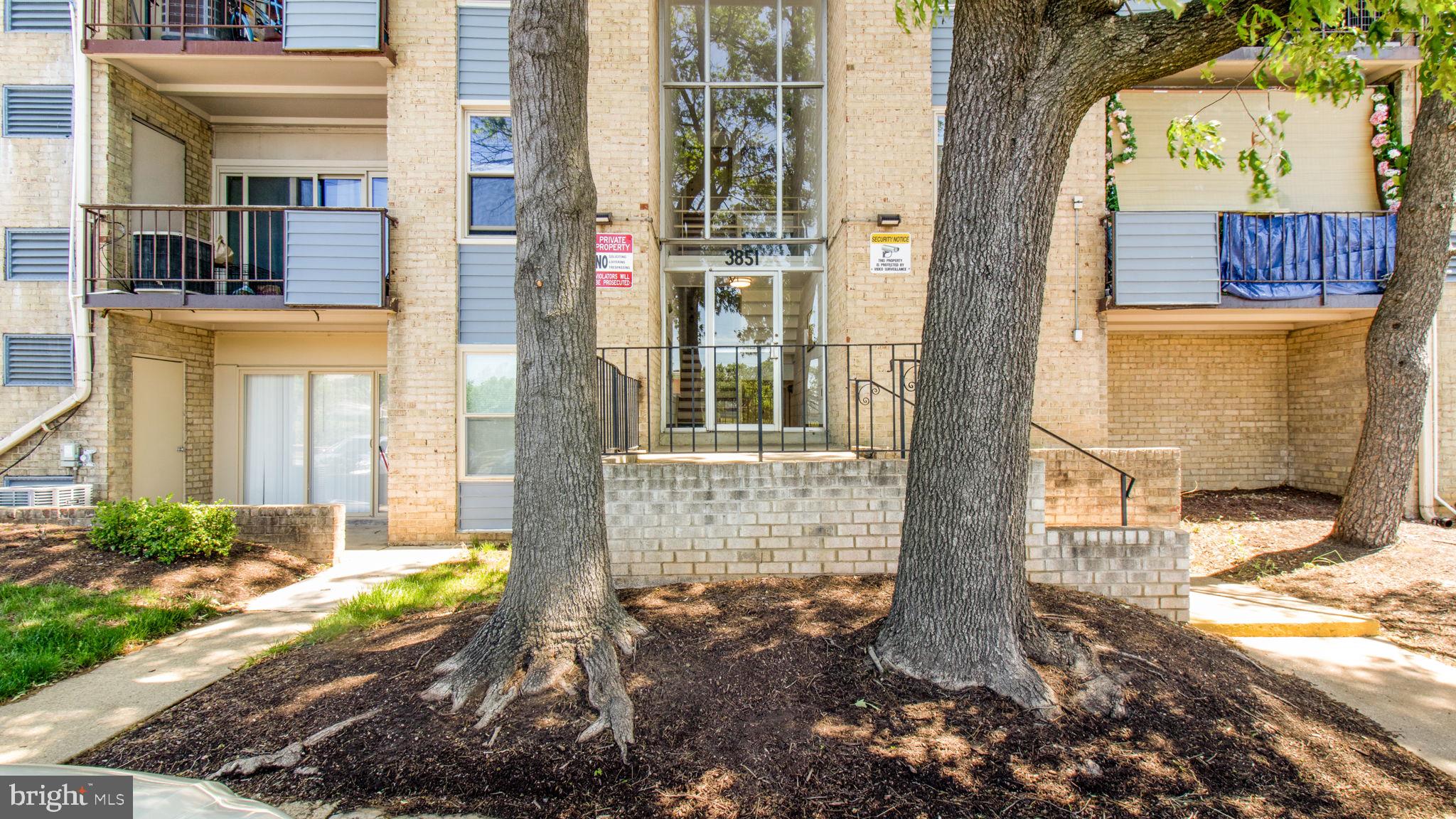 3851 St Barnabas Road, Unit 103 Suitland, MD 20746 - Photo 20 of 43 a front view of a house with a yard