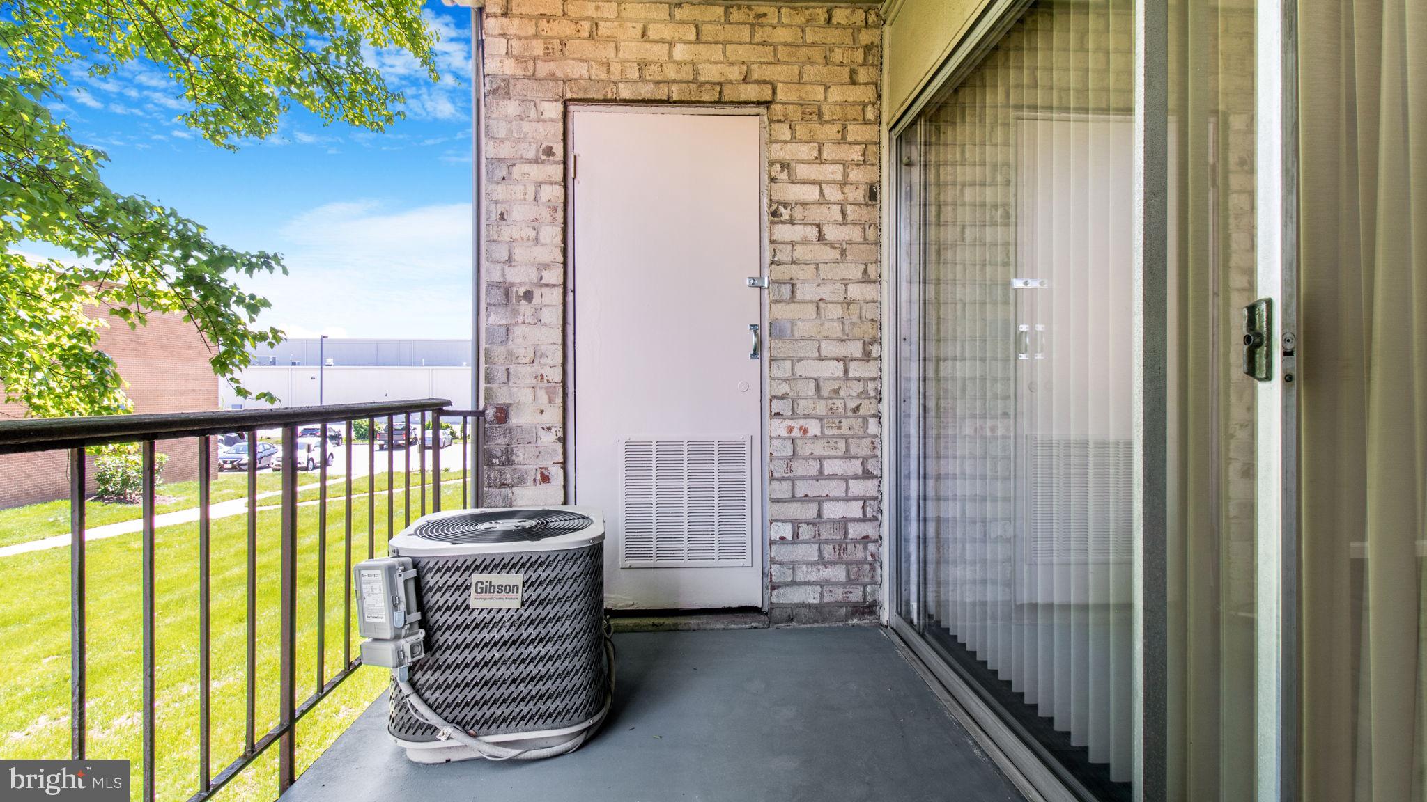 3851 St Barnabas Road, Unit 103 Suitland, MD 20746 - Photo 22 of 43 a view of a balcony with chair