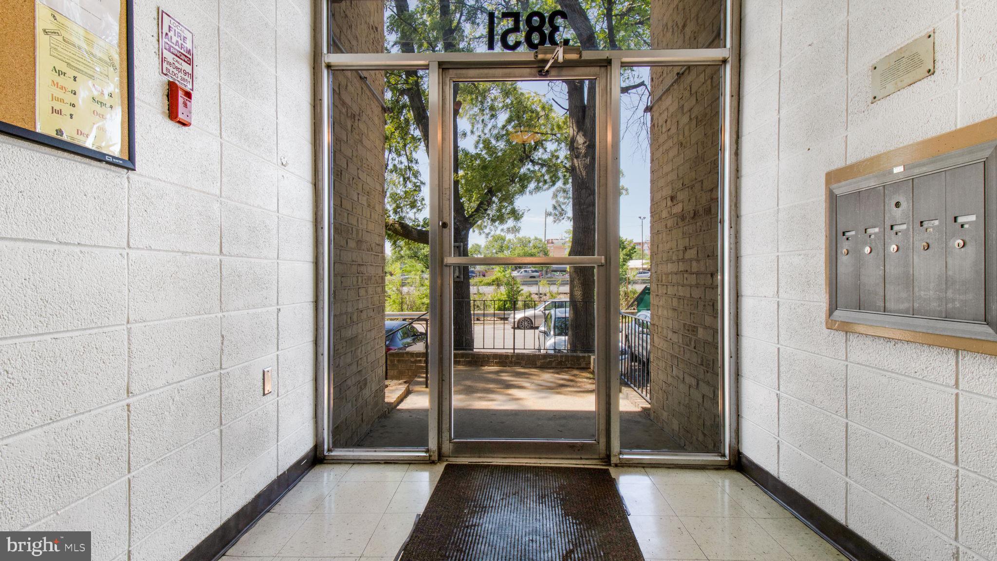 3851 St Barnabas Road, Unit 103 Suitland, MD 20746 - Photo 28 of 43 a view of an entryway with a floor to ceiling window