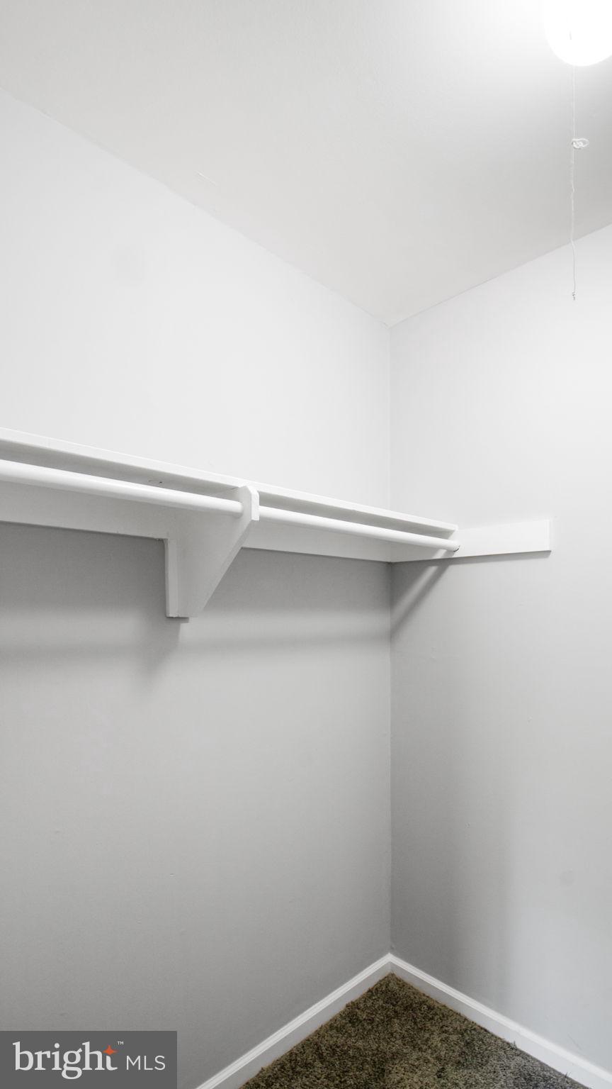 3851 St Barnabas Road, Unit 103 Suitland, MD 20746 - Photo 3 of 43 a view of small space with racks on the wall