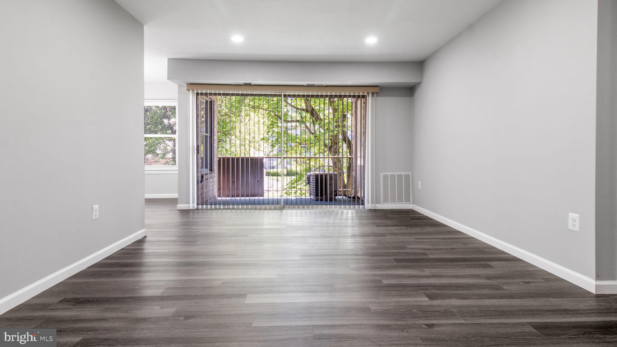 3851 St Barnabas Road, Unit 103 Suitland, MD 20746 - Photo 35 of 43 wooden floor in an empty room with a window