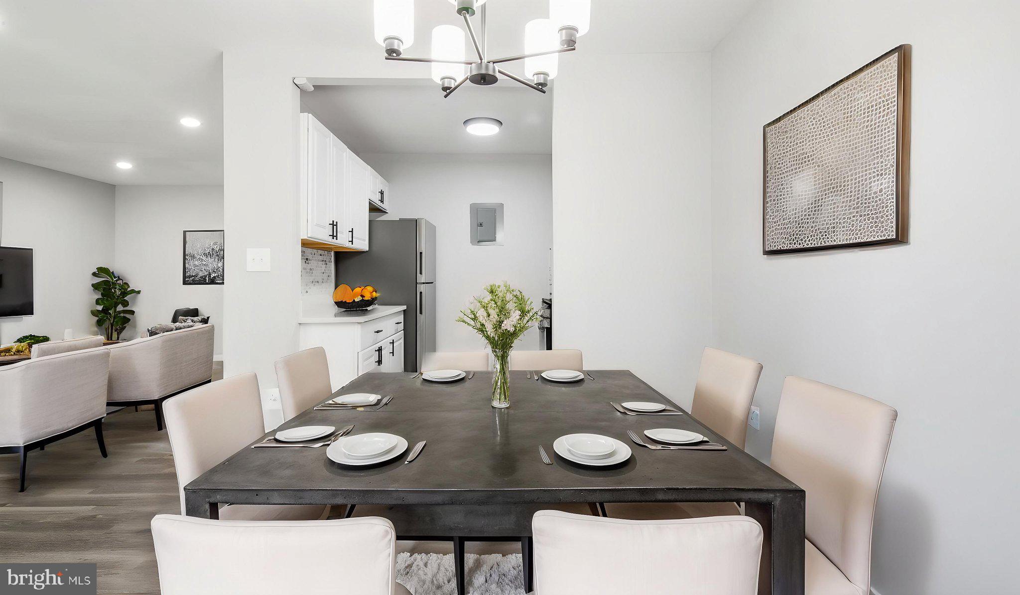 3851 St Barnabas Road, Unit 103 Suitland, MD 20746 - Photo 43 of 43 a view of a dining room with furniture and wooden floor