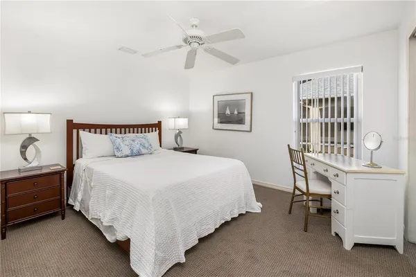 a bedroom with furniture and a window