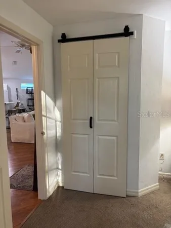 a en suite bathroom with a glass shower door and a mirror