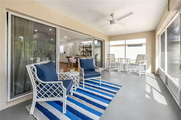 a living room with furniture and outdoor view